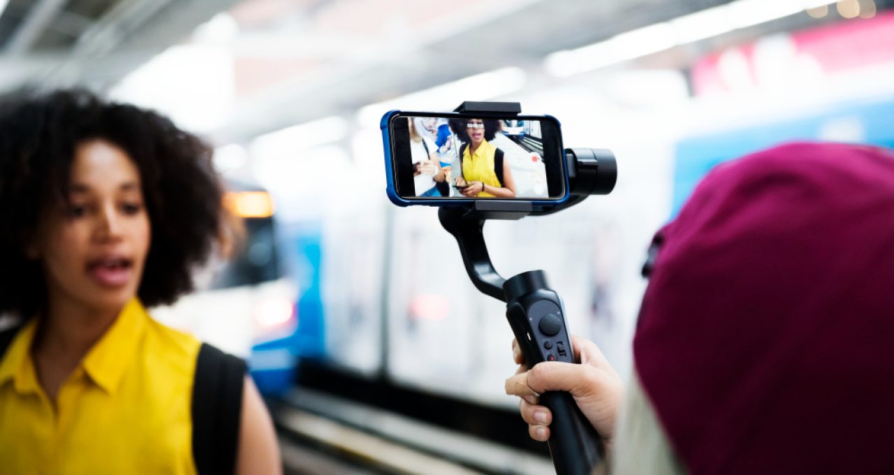 young-adult-woman-traveling-vlogging-social-media-concept
